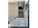White staircase and built-in shelving unit at 902 W Main St, Greenfield, IN 46140