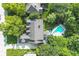 Aerial view of home and inground pool surrounded by mature trees at 11633 Trail Ridge Pl, Zionsville, IN 46077