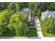 Birds eye view of brick home, lush landscaping and a long driveway at 11633 Trail Ridge Pl, Zionsville, IN 46077