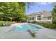 Expansive backyard featuring a sparkling pool, diving board, and elegant outdoor seating at 11633 Trail Ridge Pl, Zionsville, IN 46077