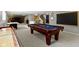 Finished basement featuring a pool table, shuffleboard table, and entertainment area at 11633 Trail Ridge Pl, Zionsville, IN 46077