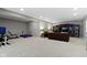 Spacious finished basement with an entertainment center and exercise equipment at 11633 Trail Ridge Pl, Zionsville, IN 46077