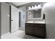 Bathroom featuring a vanity with a mirror and modern lighting at 11633 Trail Ridge Pl, Zionsville, IN 46077