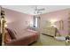 Pink bedroom featuring a window desk, shelves and plush rug at 11633 Trail Ridge Pl, Zionsville, IN 46077