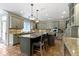 Modern kitchen with custom cabinets, granite countertops and large kitchen island at 11633 Trail Ridge Pl, Zionsville, IN 46077
