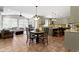 Open concept features kitchen with granite counters, dining table, and sitting area at 11633 Trail Ridge Pl, Zionsville, IN 46077