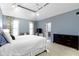 Spacious main bedroom with cathedral ceiling, carpet floors, and ensuite bathroom entrance at 11633 Trail Ridge Pl, Zionsville, IN 46077