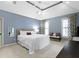 Main bedroom features a trey ceiling, a large bed, and bright natural light at 11633 Trail Ridge Pl, Zionsville, IN 46077