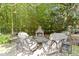 Cozy outdoor fireplace with comfortable seating for relaxing evenings at 11633 Trail Ridge Pl, Zionsville, IN 46077