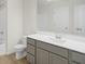 Bathroom with gray vanity, white countertop, and a shower/tub combo at 3885 Wren Dr, Brownsburg, IN 46112