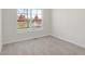 Spacious bedroom with a large window overlooking a pond and trees at 3885 Wren Dr, Brownsburg, IN 46112