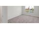 Bright bedroom featuring a large window and neutral carpeting at 3885 Wren Dr, Brownsburg, IN 46112