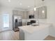 Modern kitchen with gray cabinets and island at 3885 Wren Dr, Brownsburg, IN 46112