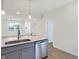 Modern kitchen features a large island with stainless steel appliances at 3885 Wren Dr, Brownsburg, IN 46112