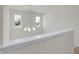 Bright landing area with chandelier and two windows at 3885 Wren Dr, Brownsburg, IN 46112