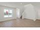 Spacious living room with hardwood floors and window at 3885 Wren Dr, Brownsburg, IN 46112