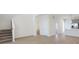 Bright living area with hardwood floors and staircase at 3885 Wren Dr, Brownsburg, IN 46112