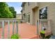 Spacious wooden deck with railings, perfect for outdoor dining and relaxation, overlooking the lush backyard at 1936 Broadmoor Ln, Columbus, IN 47203