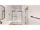 Modern bathroom with frameless shower and matte black fixtures at 9870 Bucklebury Ln, Carmel, IN 46280