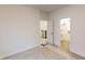 Bright bedroom with a walk-in closet and access to a hallway at 9870 Bucklebury Ln, Carmel, IN 46280