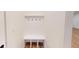 Functional entryway with built-in bench and hooks at 9870 Bucklebury Ln, Carmel, IN 46280