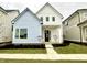 Two-story craftsman style home with light blue and white siding at 9870 Bucklebury Ln, Carmel, IN 46280