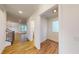 Light and bright hallway with wood floors and access to other rooms at 9870 Bucklebury Ln, Carmel, IN 46280