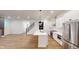 Open concept kitchen with white cabinets and stainless steel appliances at 9870 Bucklebury Ln, Carmel, IN 46280
