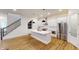Modern kitchen with white cabinets and a large island at 9870 Bucklebury Ln, Carmel, IN 46280