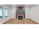 Living room with fireplace and plenty of natural light at 9870 Bucklebury Ln, Carmel, IN 46280