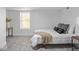 Bright bedroom featuring a neutral color palette and a comfortable bed with plush pillows at 1210 Finley Ave, Indianapolis, IN 46203