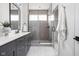Modern bathroom featuring a glass enclosed shower, stylish vanity, and neutral accents at 1659 Midland Main St, Westfield, IN 46074