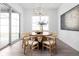 Bright dining room features a round table, modern lighting, and sliding glass doors at 1659 Midland Main St, Westfield, IN 46074