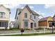 Attractive two-story home with a brick and gray siding exterior, and professionally landscaped front yard at 1659 Midland Main St, Westfield, IN 46074