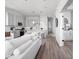 Well-lit, open-concept kitchen with stainless steel appliances and a long island with barstool seating at 1659 Midland Main St, Westfield, IN 46074