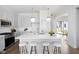 Modern kitchen with an island, barstool seating, and stainless steel appliances at 1659 Midland Main St, Westfield, IN 46074