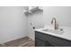 Laundry room with a utility sink and overhead shelving at 1659 Midland Main St, Westfield, IN 46074