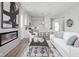 Open-concept living area showcasing a fireplace, seamless flow to the kitchen, and neutral palette at 1659 Midland Main St, Westfield, IN 46074