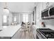 Bright, open-concept kitchen and living area; featuring a fireplace and stainless steel appliances at 1659 Midland Main St, Westfield, IN 46074