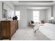 Spacious main bedroom with a dresser, accent chair and plush carpeting at 1659 Midland Main St, Westfield, IN 46074