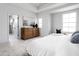 Elegant main bedroom with ensuite bathroom access, a dresser, and plush carpeting at 1659 Midland Main St, Westfield, IN 46074