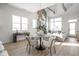 Modern dining area with round table and four chairs, situated near a fireplace at 17327 Newton Main St, Westfield, IN 46074