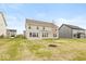 Spacious backyard featuring new construction home with large windows and a well maintained lawn at 1099 Gatewick Ct, Greenwood, IN 46143