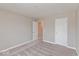 Neutral bedroom with carpet, two doors, and neutral paint at 1099 Gatewick Ct, Greenwood, IN 46143