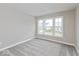 Bright bedroom with three windows, plush carpet, and neutral paint at 1099 Gatewick Ct, Greenwood, IN 46143