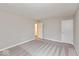 Bedroom with new carpet, two doors, and neutral paint at 1099 Gatewick Ct, Greenwood, IN 46143