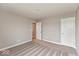 Neutral bedroom with carpet, two doors, and neutral paint at 1099 Gatewick Ct, Greenwood, IN 46143
