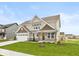 Charming two-story home with manicured lawn and attached two car garage at 1099 Gatewick Ct, Greenwood, IN 46143