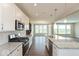 Contemporary kitchen featuring stainless steel appliances and granite countertops at 1099 Gatewick Ct, Greenwood, IN 46143