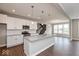 Well-lit kitchen with stainless steel appliances, granite countertops, and seamless open layout at 1099 Gatewick Ct, Greenwood, IN 46143